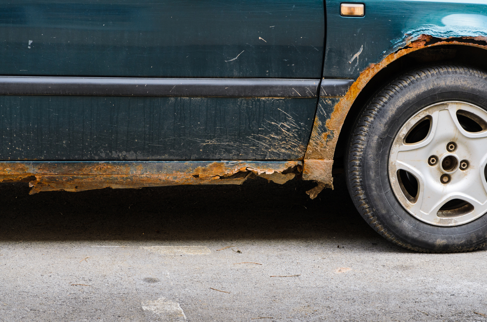 Car,with,rust,and,corrosion,,damage,from,road,salt